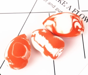 Three-piece salmon makeup sponge set including teardrop, gourd, and slanted cut shapes