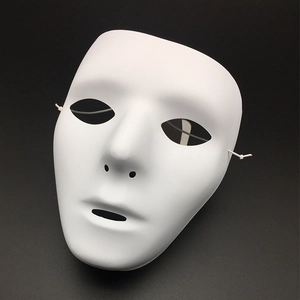 Macro shot of a plain white full-face dance mask with smooth texture and elastic straps