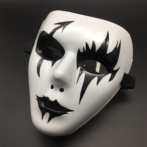 Detail view of white full face Halloween mask with black artistic patterns and elastic band