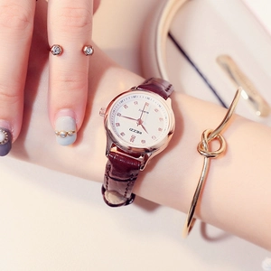 Elegant quartz watch for women with golden round case and burgundy leather strap