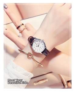 Close-up of a minimalist women's quartz watch set with rhinestones and matching jewelry