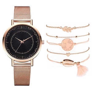 Detailed view of rose gold quartz watch and five matching fashion charm bracelets set