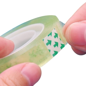 Strong transparent stationery tape roll with green arrow start label for students