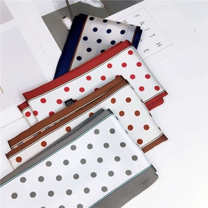 Elegant polka dot silk-feel skinny scarves in navy, red, brown, and gray colors
