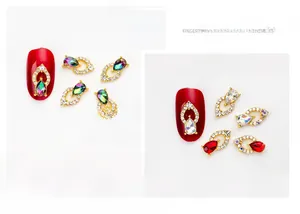 Detailed look at gold alloy nail jewels with AB crystals and emerald drop stones