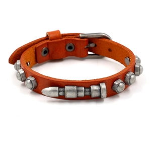 Orange leather punk bracelet with vintage metal bullet studs and nut hardware