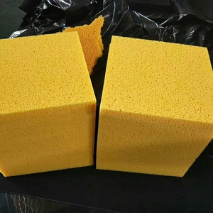 Detailed texture of natural yellow wood pulp facial sponges with porous surface design