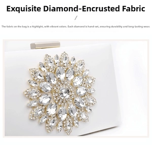 Close-up of sparkling floral rhinestone crystal decoration on white evening clutch bag