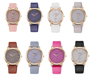 Flat lay of eight colorful quartz watches for women with glitter dials and leather straps