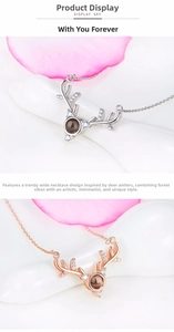 Detailed view of silver and rose gold deer antler necklaces with projection beads