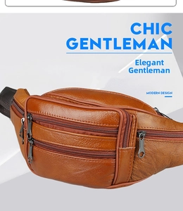 Dettaglio del marsupio in pelle marrone con trama litchi e tasche con cerniera in metallo