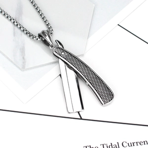 Mens silver stainless steel razor blade pendant necklace with textured detail on box chain