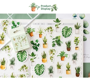 Close-up of tropical green plant stickers featuring monstera and cactus for DIY journaling