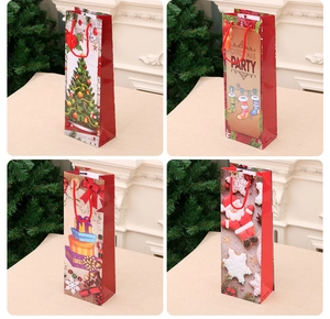 Set of four festive Christmas wine bottle gift bags with holiday patterns and red handles