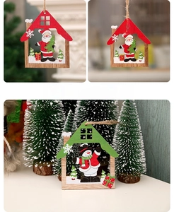 Detail of wooden hollow house ornaments with hand-painted Santa and Snowman styles