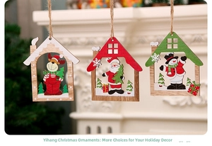 Close-up of three wooden hollow Christmas house ornaments with Santa and reindeer motifs