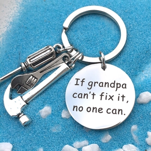 Close-up of stainless steel father gift keychain with hammer, wrench and screwdriver charms