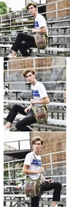 Detail of army green canvas messenger bag with brown leather accents on industrial background