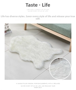 Close-up of fluffy white faux sheepskin rug showing thick pile texture and natural shape