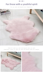 Detailed texture of pink faux sheepskin rug with fluffy long pile fibers for home decor