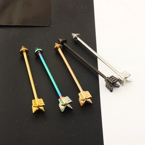 Arrow industrial barbell piercings set in gold, rainbow, rose gold, black, and silver steel