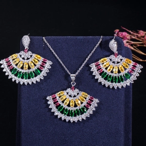 Colorful zircon fan-shaped pendant necklace and earrings set on blue velvet display