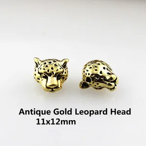 Detail view of 11x12mm antique gold leopard head metal beads for DIY jewelry making