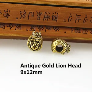 Macro detail of antique gold lion head bead with crown for DIY jewelry 9x12mm