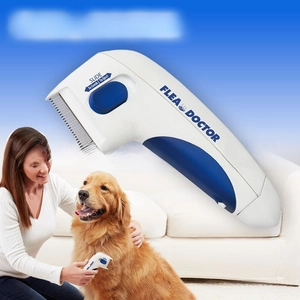 Close-up of electric flea comb metal teeth with sliding mechanism for pet grooming