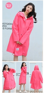 Detail of rose red long hooded raincoat with matching carry pouch and pocket view