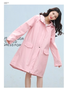 Close-up of pink hooded raincoat featuring dual flap pockets and waterproof matte texture