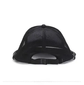 Detail of black mesh sun hat featuring a breathable net structure and adjustable plastic strap