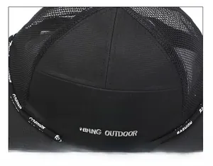 Detail of durable stitching and breathable mesh on black outdoor fishing sun hat