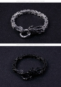 Detail of silver and black dragon head Byzantine chain bracelets in stainless steel