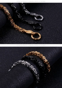 Detail of stainless steel Byzantine chain bracelet in gold, silver, and black colors