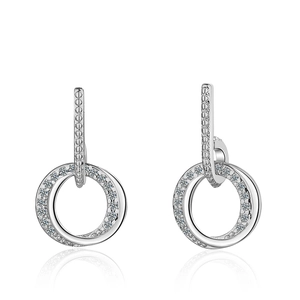 Elegant silver circle earrings with sparkling zircons and a soft mirror reflection