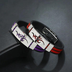 Detail view of purple and red silicone bracelets with black flame pattern stainless steel plates