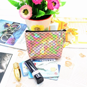 Detailed view of laser fish scale texture coin purse with rainbow metallic finish