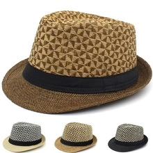 Detail view of woven sun hats in brown, beige, khaki, and black with ribbon bands
