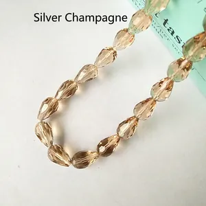 Detailed macro shot of faceted silver champagne waterdrop glass beads for DIY jewelry