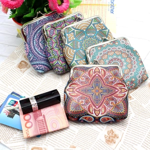 Ethnic style coin purses with mandala patterns and vintage metal clasps on a table