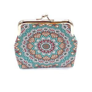 Detailed front view of ethnic canvas coin purse with colorful mandala pattern and gold kiss lock