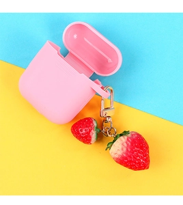 Detailed view of pink silicone earphone case with realistic strawberry charm and gold clip