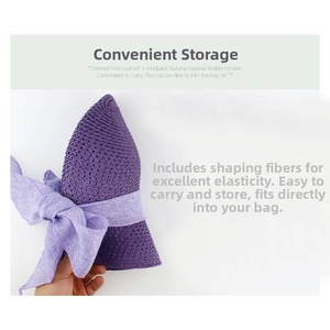 Detail showing the flexible foldable purple straw hat with shapeable wire and bow