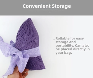 Foldable purple straw hat with a bow, demonstrating portable and rollable storage design