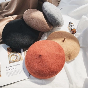 Classic wool beret hats for women in autumn colors like black, brown, and orange
