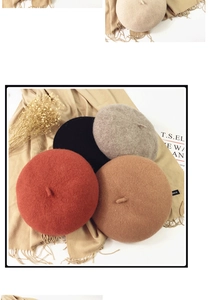 Detailed texture of wool beret hats in black, red and grey on a decorative background