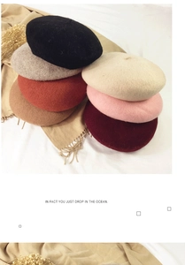 Collection of wool beret hats in black, grey, beige and red for autumn and winter styles
