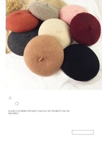 Close-up of wool beret stack in various autumn colors including red, beige and black