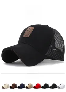 Detail of breathable mesh baseball cap with EDIKO embossed leather logo and curved brim